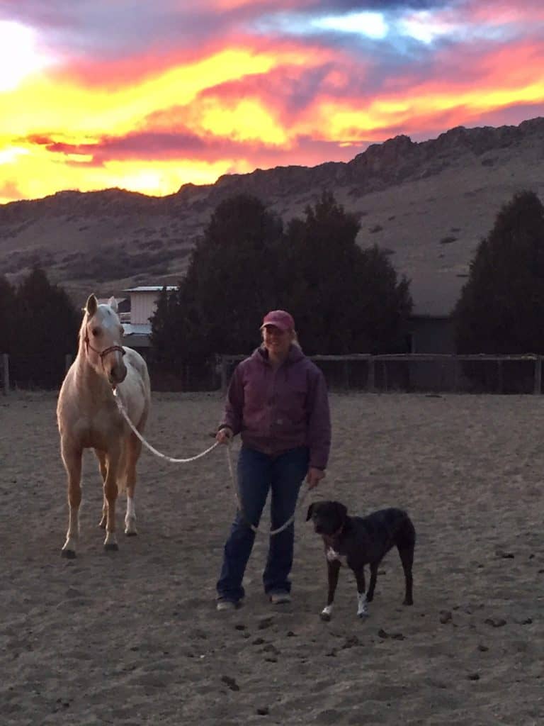 Sarah with female catahoula dog mix and Palomino quarter horse filly 